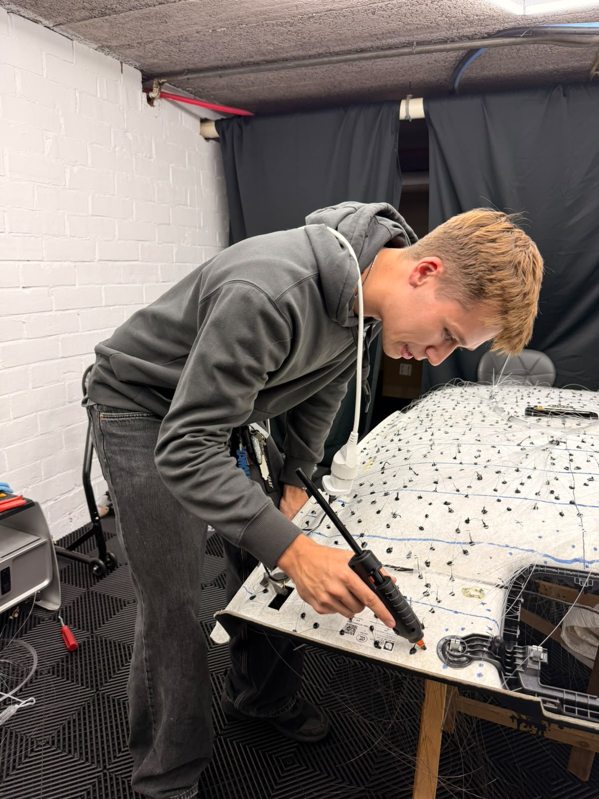 Fibre-optic strands being fitted to the Golf GTI headliner panel