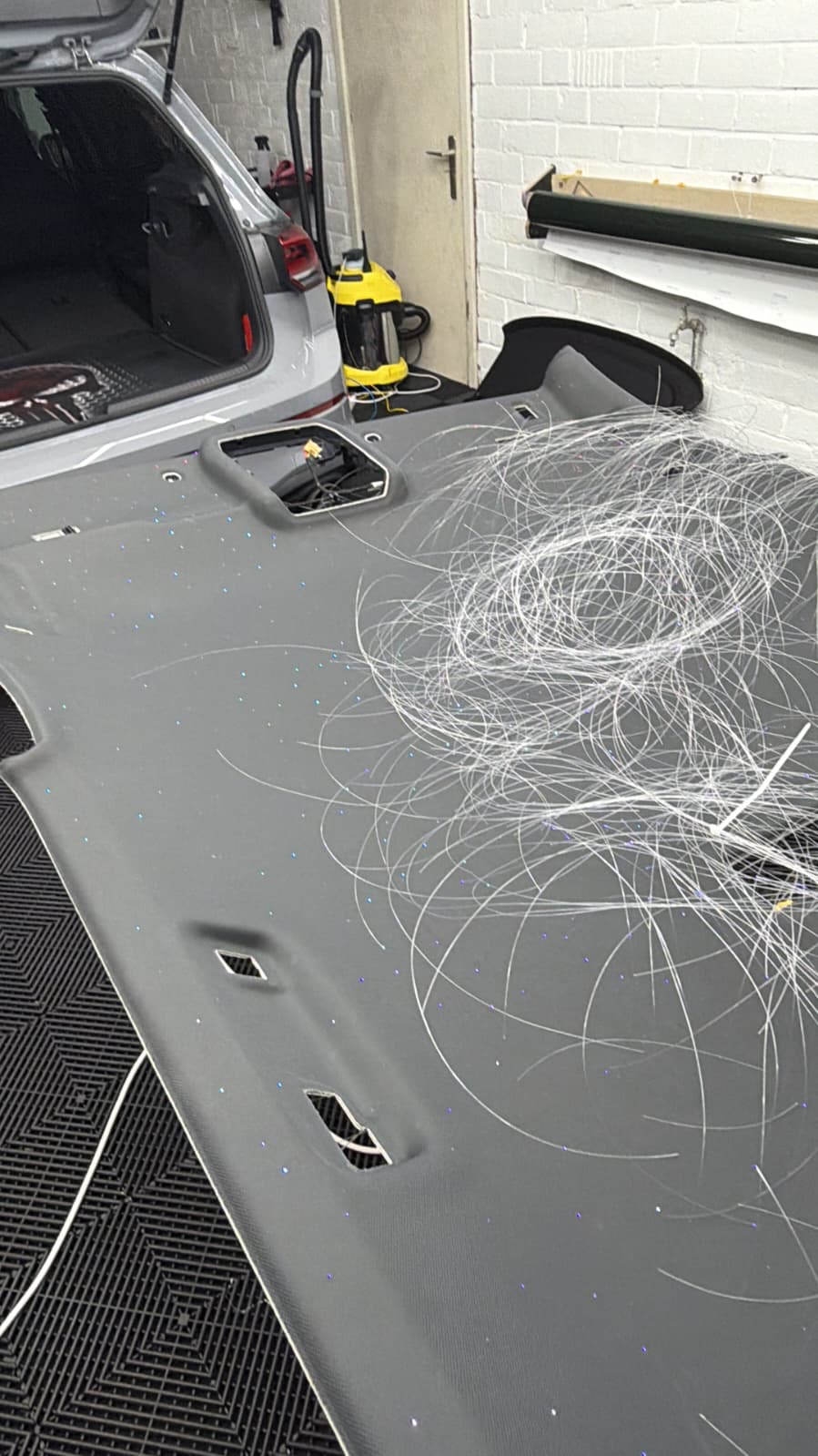 Golf GTI starlight headliner panel during fibre-optic install