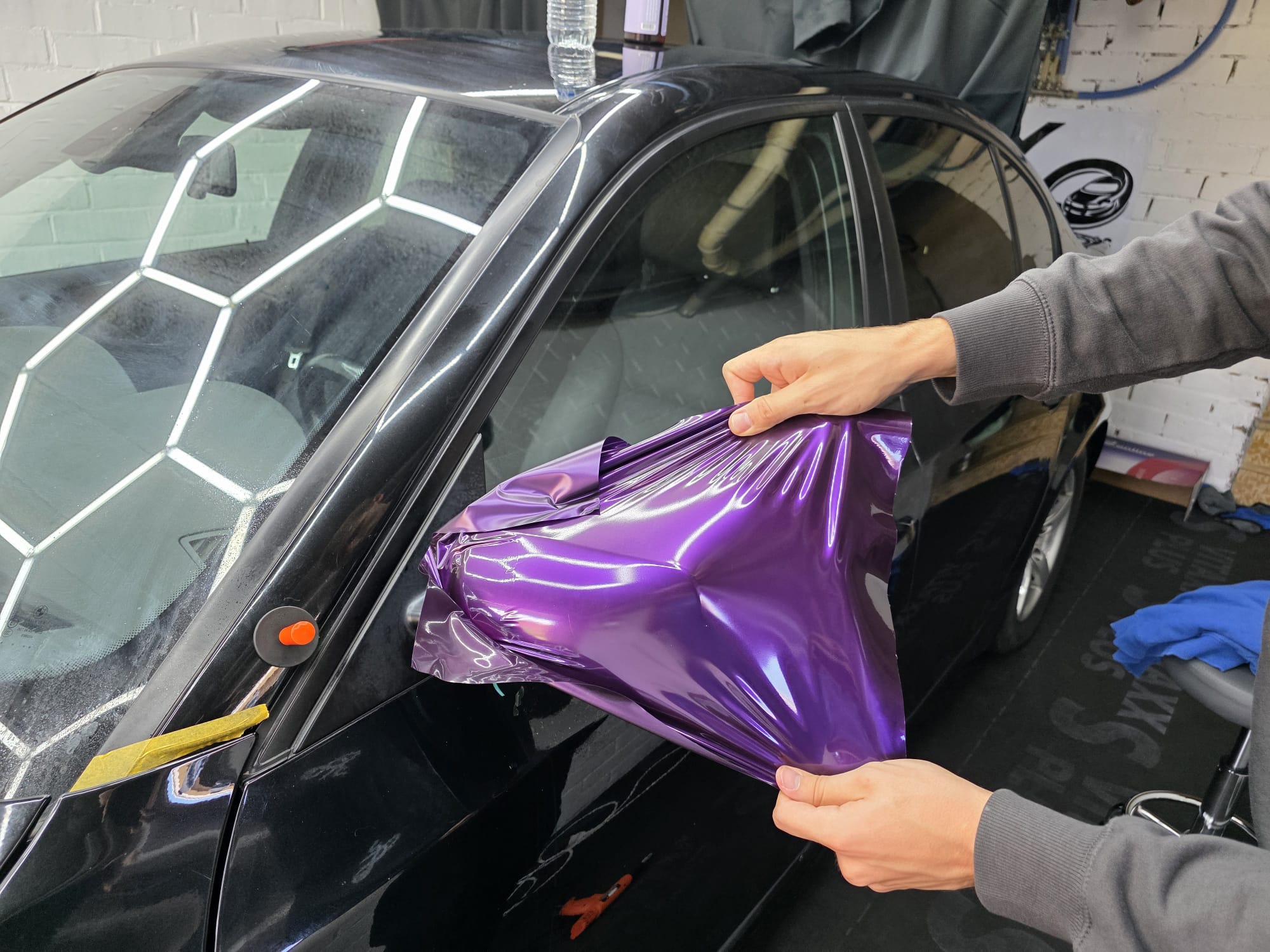 Vehicle vinyl wrap installation at 360 Customs
